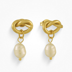 Gold earrings with knot design and pearl drops on a white background